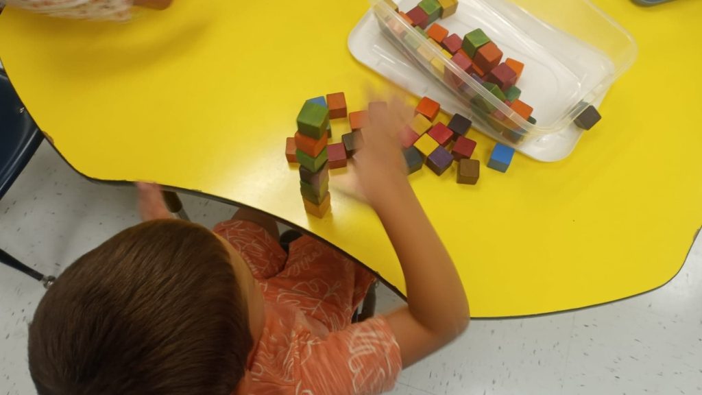 Simple activities for preschoolers.  Counting, sorting and stacking colorful blocks