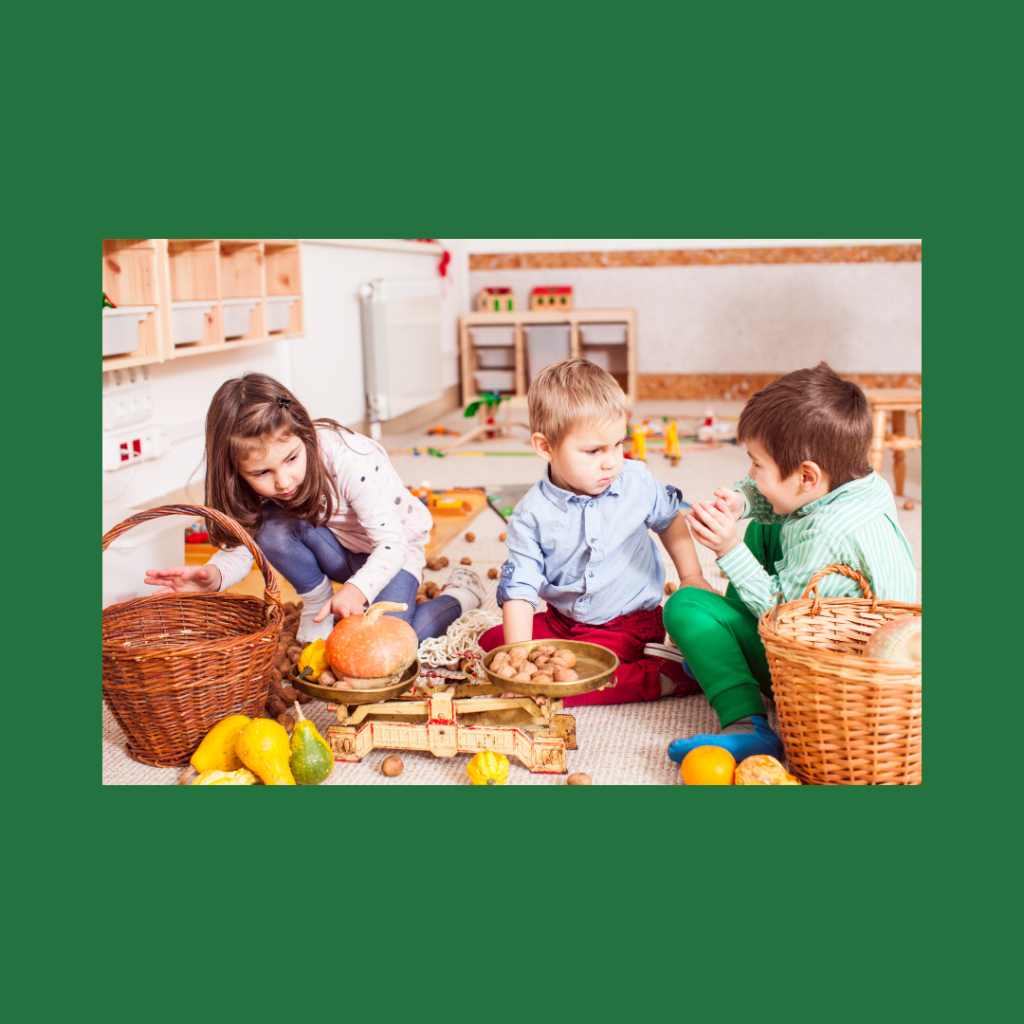 Children participating in play-based learning by playing with baskets of toy food in the dramatic play area